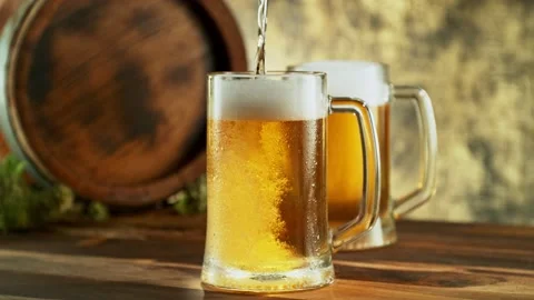 Super slow motion of pouring beer into pint at high speed. Stock Footage 237168424