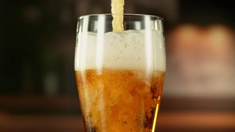 Super Slow Motion of Pouring Beer into Long Pint. Stock Footage 287602501