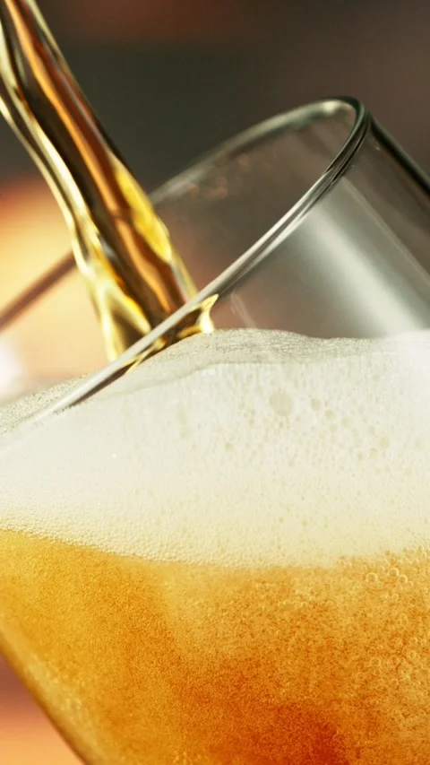 Super Slow Motion of Pouring Beer into Long Pint. Stock Footage 289317107