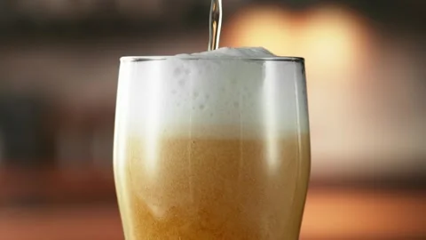 Super Slow Motion of Pouring Beer into Long Pint. Stock Footage 310947014