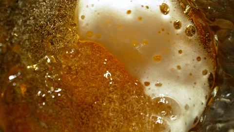 Super Slow Motion of Pouring Beer Inside Glass With Camera Motion Into Liquid at Stock Footage 320394983