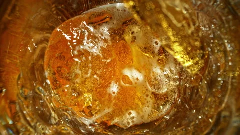 Super Slow Motion of Pouring Beer Inside Glass With Camera Motion Into Liquid at Stock Footage 326916776