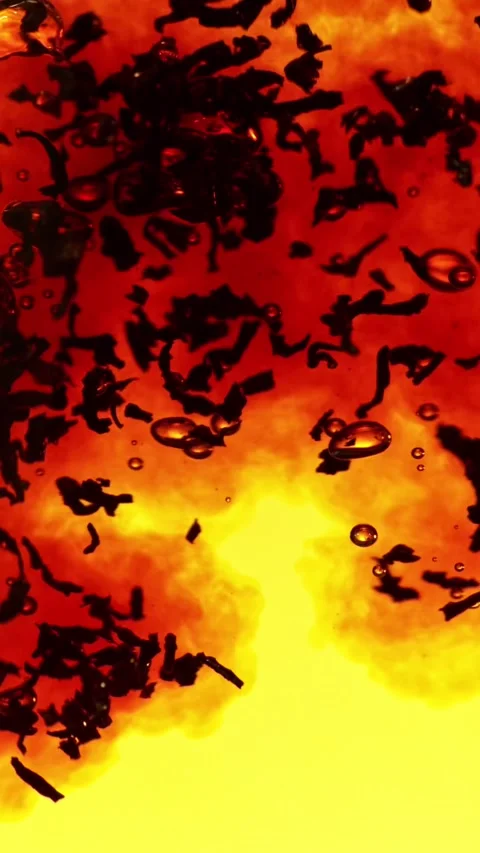 Super slow motion of pouring black tea into water in twister shape. Stock Footage 308371203