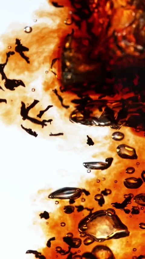 Super slow motion of pouring black tea into water in twister shape. Stock Footage 308371255