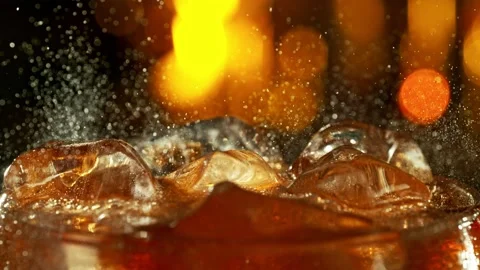 Super slow motion of pouring cola drink with bubbles Stock Footage 233256364