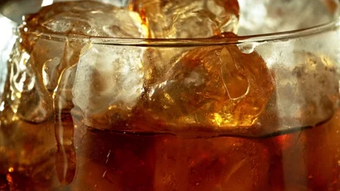 Super slow motion of pouring cola into glass with speed motion Stock Footage 237168101