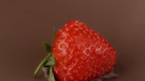 Super slow motion of pouring dark hot chocolate with strawberry. Stock Footage 141069232