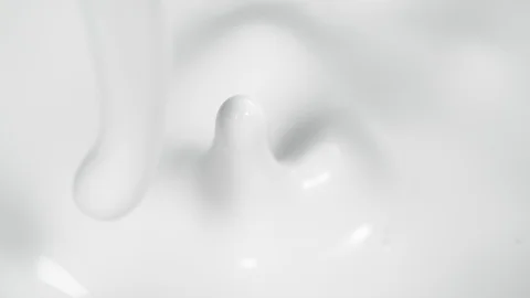 Super slow motion of pouring milk, filmed with macro lens. Stock Footage 124828085