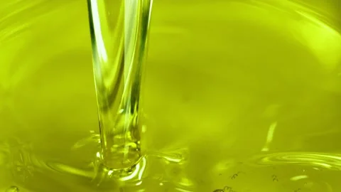 Super slow motion of pouring olive oil, macro shot. Stock Footage 195335740