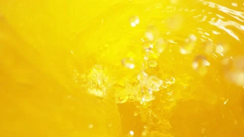 Super slow motion of pouring orange juice in twister shape. Stock Footage 147626874