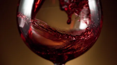Super slow motion of pouring red wine into glass in detail. Free Stock Footage 120394450