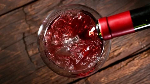 Super slow motion of pouring red wine into glass. Stock Footage 165214075