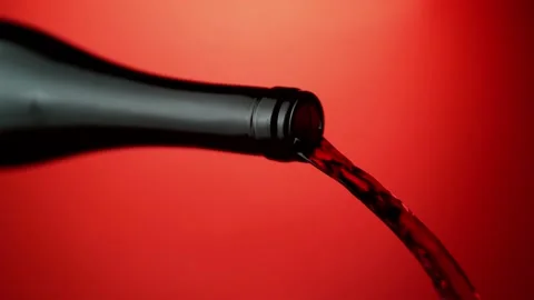 Super slow motion of pouring red wine into glass with rotate motion Stock Footage 165296173