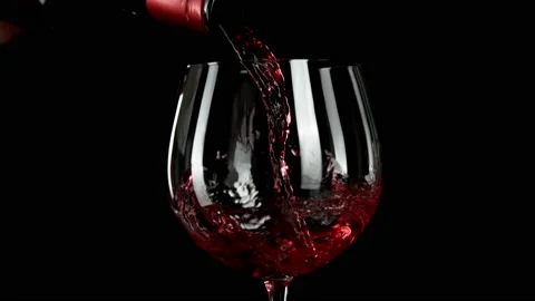 Super slow motion of pouring red wine with camera motion Stock Footage 166021539