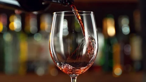 Super slow motion of pouring red wine into goblet. Stock Footage 231029690