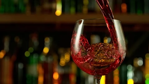 Super slow motion of pouring red wine placed on bar counter Stock Footage 232213965