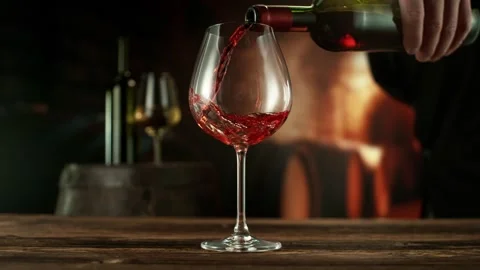 Super Slow Motion of Pouring Red Wine into Glass. Stock Footage 289227995