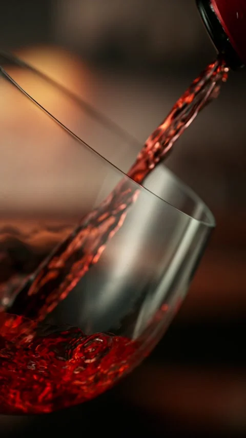Super Slow Motion of Pouring Red Wine into Glass. Stock Footage 306658717