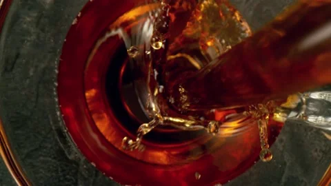 Super slow motion of pouring tea into cup with camera follow Stock Footage 148694765