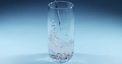 Super slow motion of pouring water into a glass Stock Footage 149210309