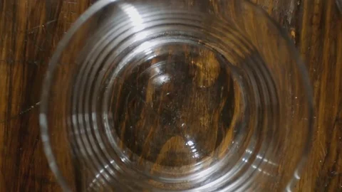 Super Slow Motion Of Pouring Whiskey Into Glass and Ice Dropped Stock Footage 112227281