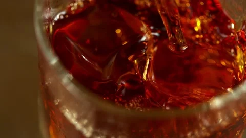 Super slow motion of pouring whiskey into glass. Stock Footage 157674801