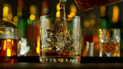 Super slow motion of pouring whiskey into glass 動画素材 233251352