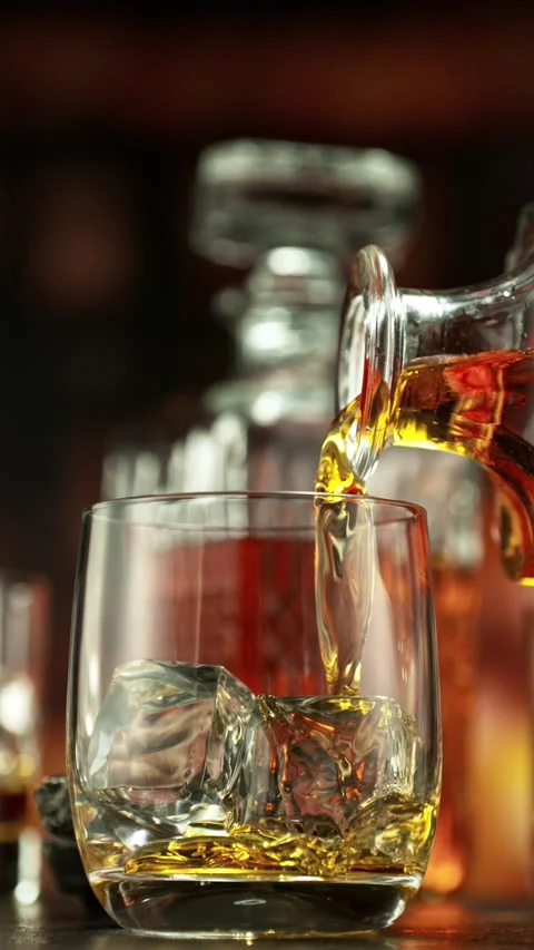 Super Slow Motion of Pouring Whiskey into Glass. Stock Footage 291828985