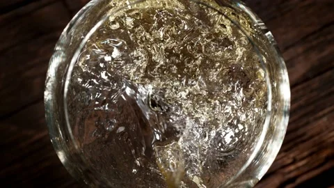 Super slow motion of pouring white wine into glass. Stock Footage 165215148