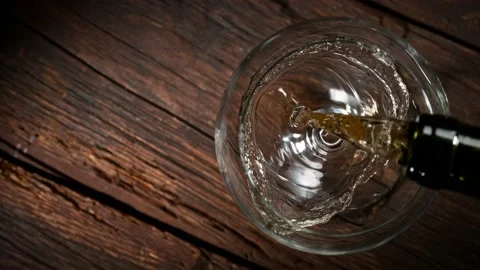 Super slow motion of pouring white wine into glass. Stock Footage 165215568