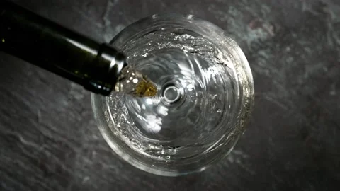 Super slow motion of pouring white wine into glass. Stock Footage 165218395