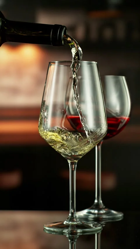 Super Slow Motion of Pouring White Wine into Glass. Stock Footage 288009045