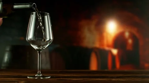 Super slow motion of pouring white wine into goblet. Stock Footage 289191176