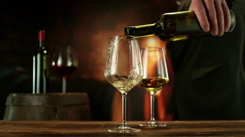 Super Slow Motion of Pouring White Wine into Glass. Stock Footage 289230259