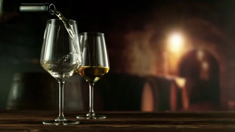 Super Slow Motion of Pouring White Wine into Glass. Stock Footage 295950471