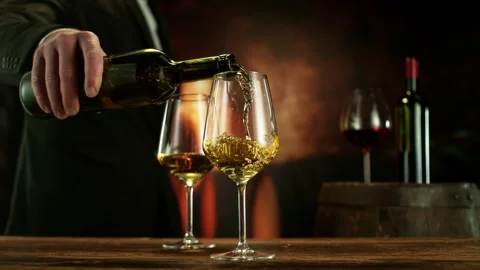 Super Slow Motion of Pouring White Wine into Glass. Stock Footage 320293261