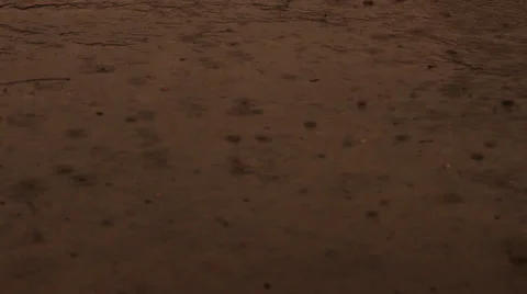 Super slow motion raindrops hitting pavement Stock Footage 35688211