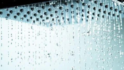 Super slow motion of raining water drops from shower Stock Footage 159123387