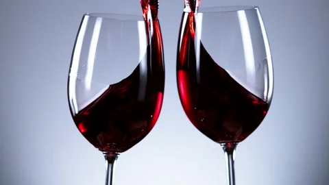 Super slow motion of red wine glasses in cheers gesture. Stock Footage 147282030