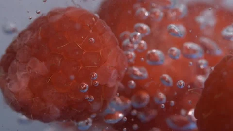 Super Slow Motion Refreshing Raspberry Scene With Sparkling Liquid, Macro Shot Stock Footage 325080799