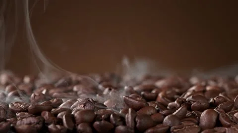 Super slow motion of roasting coffee beans with smoke Stock Footage 152472041
