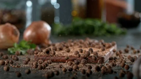 Super slow motion of rolling allspice balls on wooden board. Stock Footage 166967872
