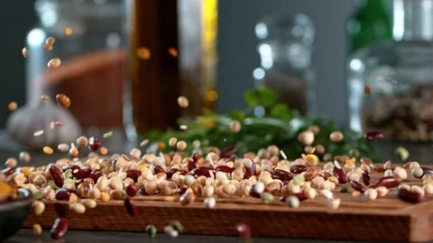 Super slow motion of rolling  legumes mix on wooden board. Stock Footage 166962732
