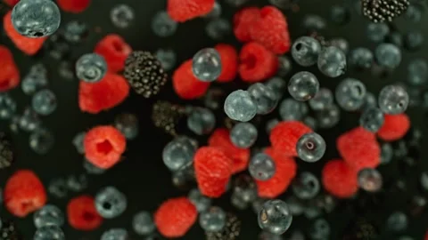 Super slow motion of rotating berries in the air, top view. Stock Footage 244997960