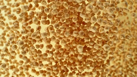 Super slow motion of rotating chickpeas in the air. Stock Footage 239635950