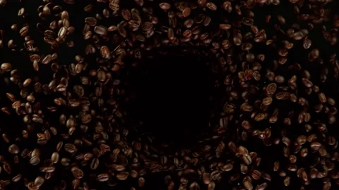 Super slow motion of rotating coffee beans on black background Stock Footage 157607177