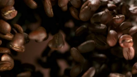 Super slow motion of rotating coffee beans on black background Stock Footage 157607851
