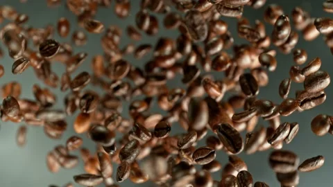 Super slow motion of rotating coffee beans. Stock Footage 227609245