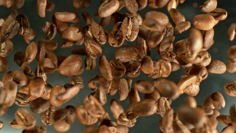 Super slow motion of rotating coffee beans on black background. Stock Footage 227609619