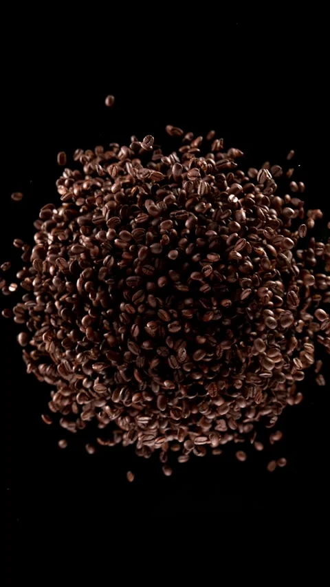 Super slow motion of rotating coffee beans. Stock Footage 306575470